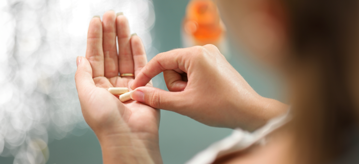 calcium pills in hand