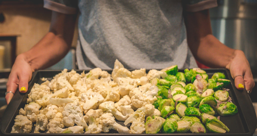 cauliflower and brussels sprouts on a pan