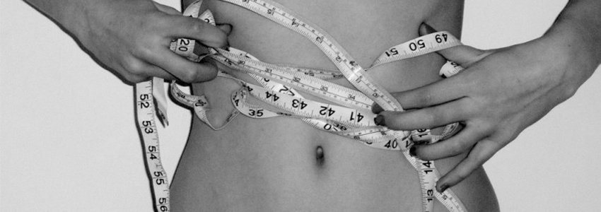 Measuring waist with measuring tape