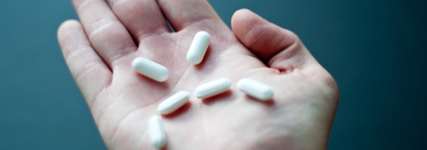 Pills displayed in the form of a sad face