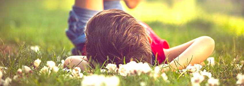 Child relaxing on grass