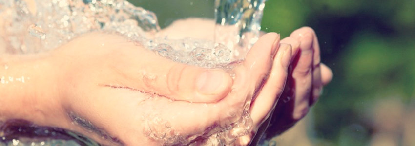 Pouring water into open hands